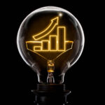 Clean and shiny lightbulb with a growing bar chart as a glowing wire.(series)